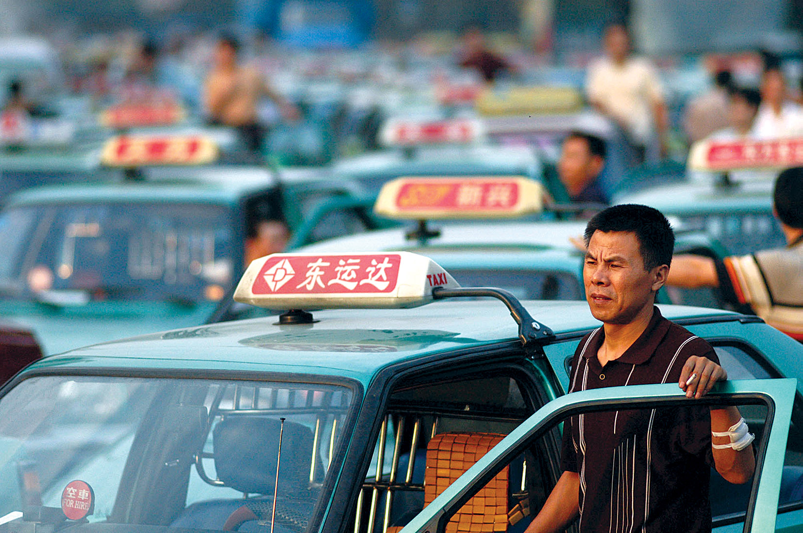 Mobile Hailing Technology and Taxi Driving Behaviors
